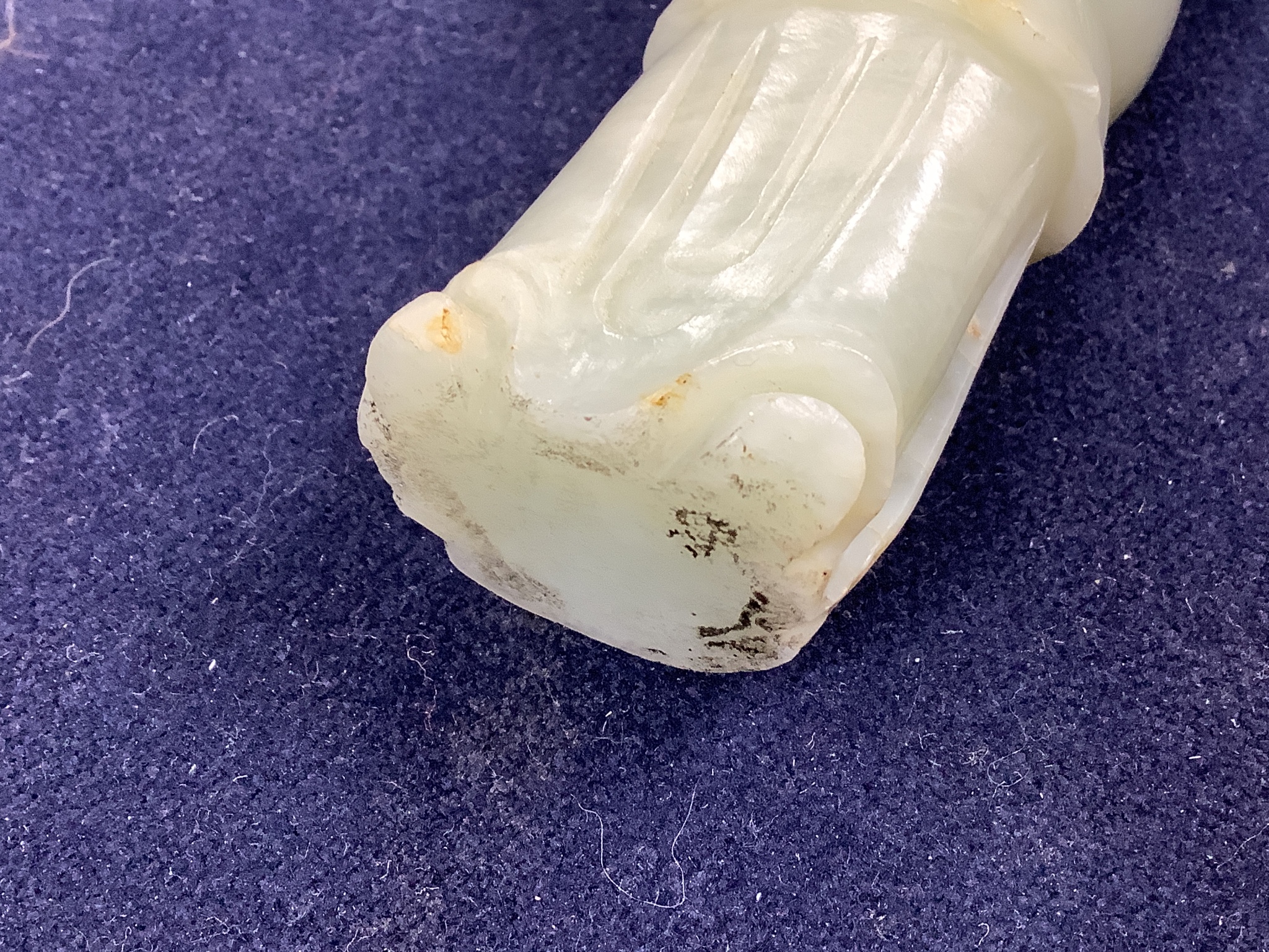 A Chinese celadon jade figure of a priest